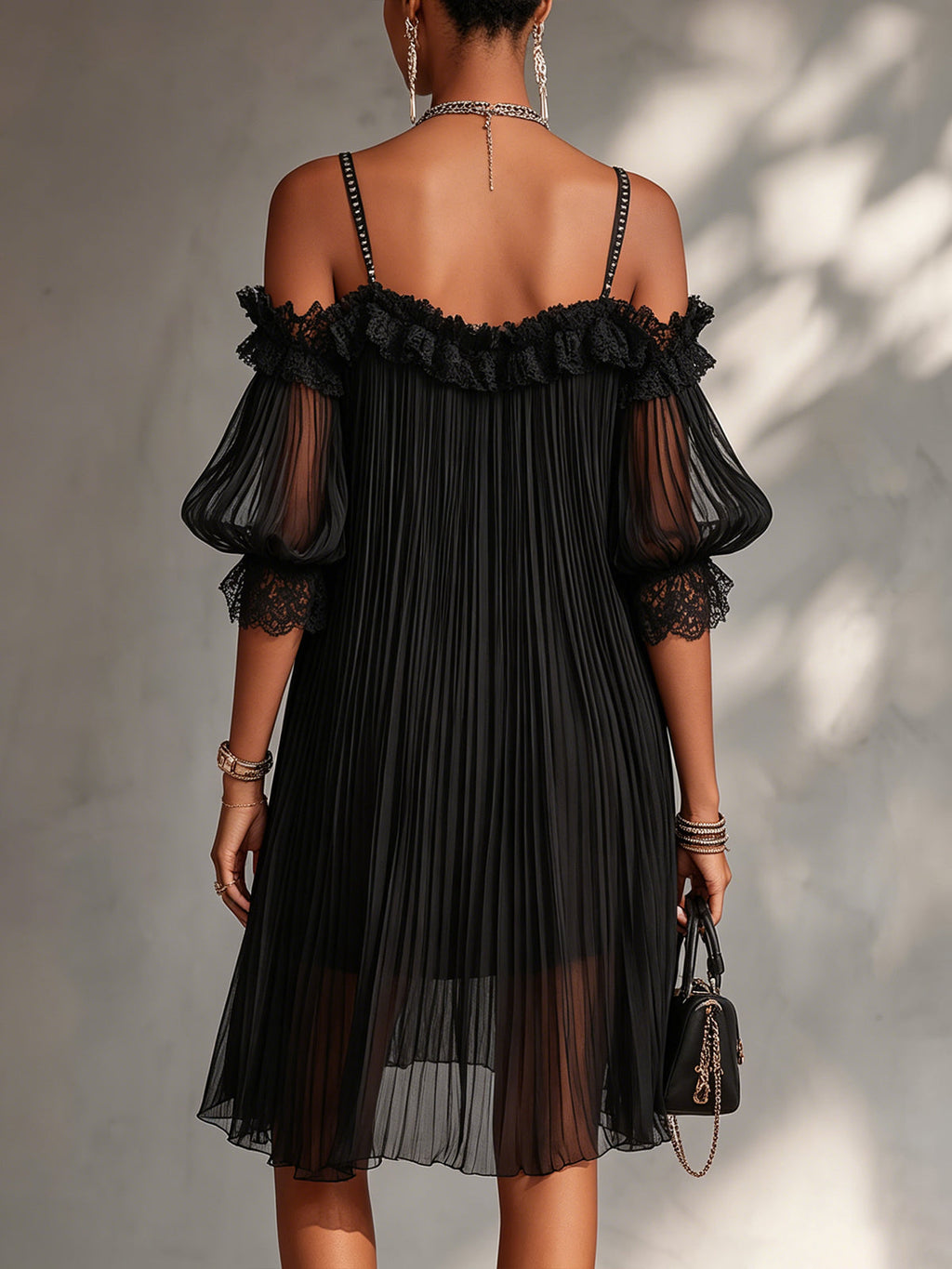 Elegant black mini dress with romantic shoulder detail