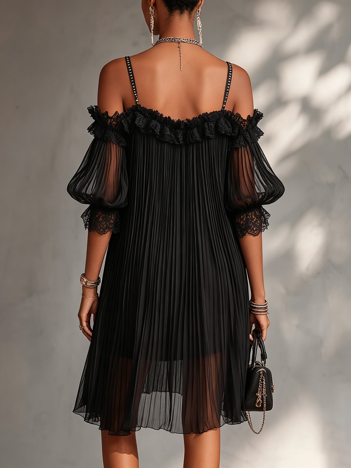 Elegant black mini dress with romantic shoulder detail
