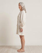 Softly draped shift dress with sculptural rosette cuffs