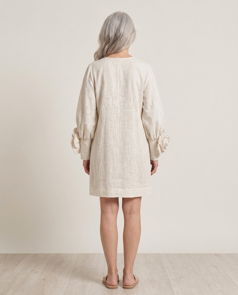 Softly draped shift dress with sculptural rosette cuffs