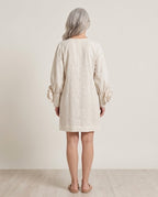 Softly draped shift dress with sculptural rosette cuffs